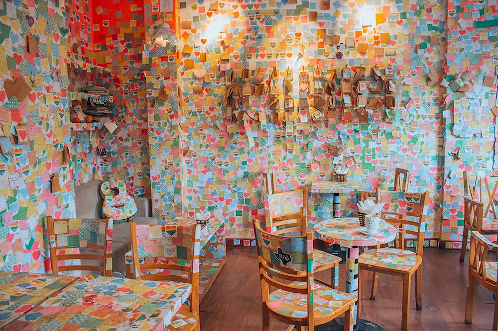 The Note Coffee is a unique space where each corner tells a story through colorful paper notes